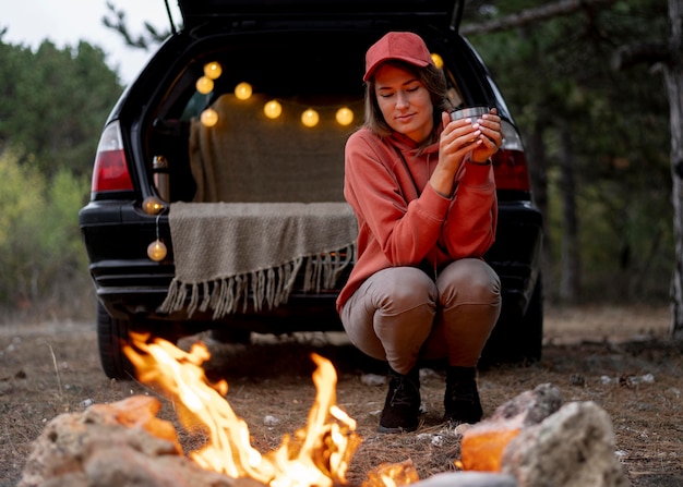 Free Photo young woman enjoying bonfire