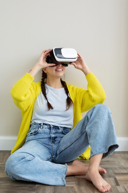 Young woman enjoying new technology vr glasses