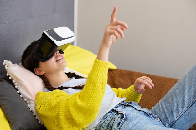 Young woman enjoying new technology vr glasses