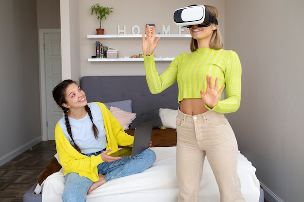 Free photo young woman enjoying new technology vr glasses