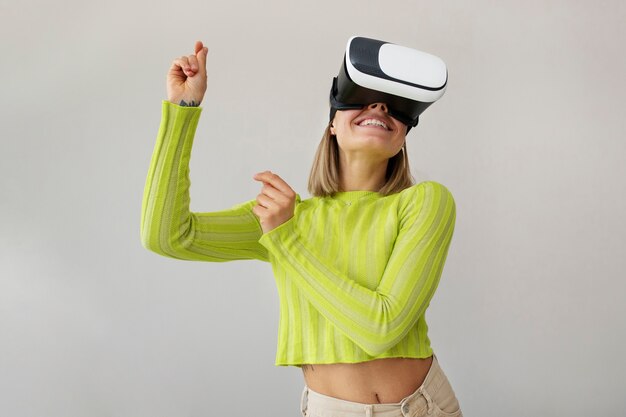 Free Photo young woman enjoying new technology vr glasses