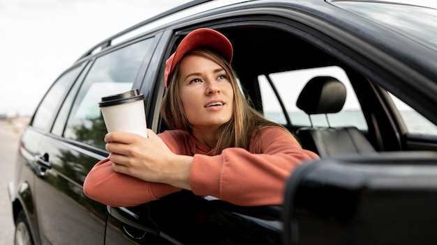 Young woman enjoying road trip