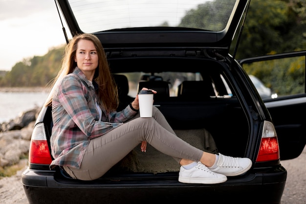 Young woman enjoying road trip