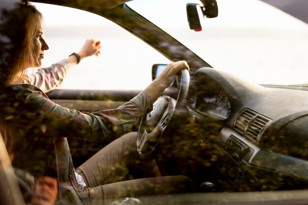 Young woman enjoying road trip