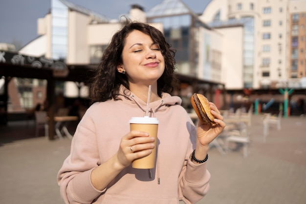 Young woman enjoying some street food