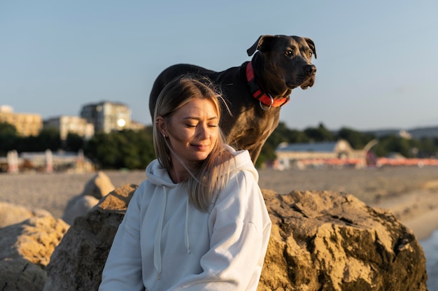 Free Photo young woman enjoying some time with her dog