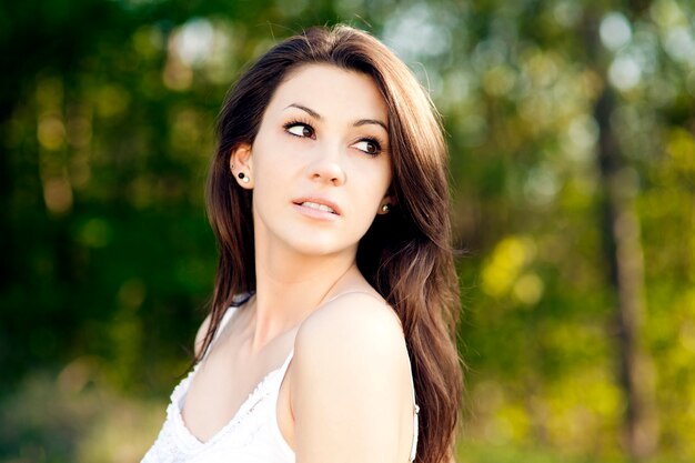 young woman enjoying the summer in a park