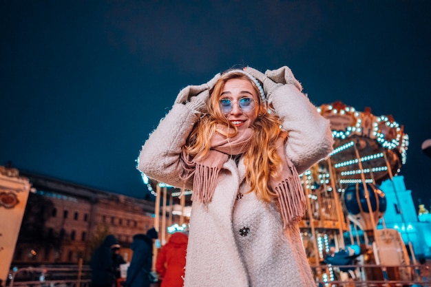 Free Photo young woman in evening street