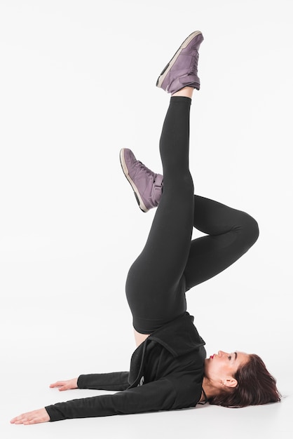 Free Photo young woman exercising against white background