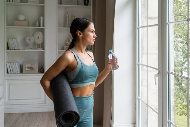 Young woman exercising at home