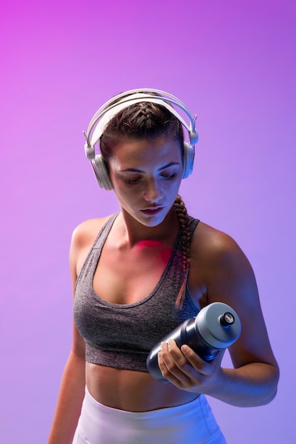 Young woman exercising with her headphones on