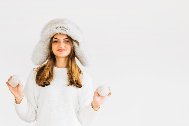 Free Photo young woman in fur hat and sweater 