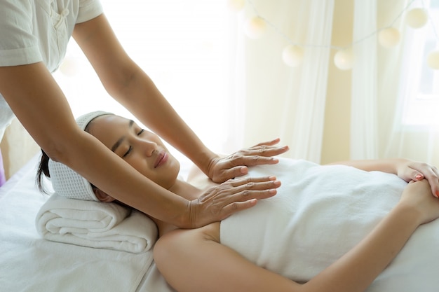 Young woman getting body massage at spa.