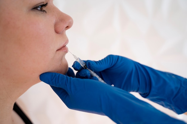 Young woman getting injection side view