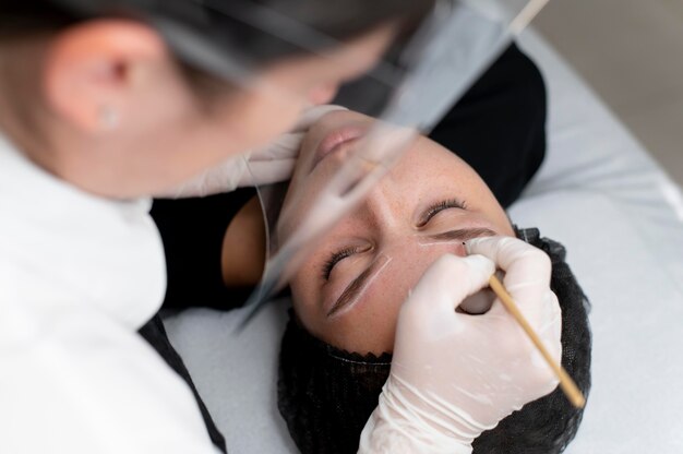 Young woman going through a microblading treatment