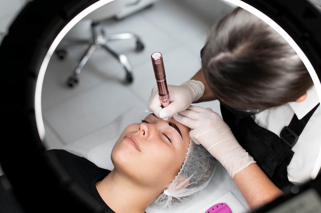 Young woman going through a microblading treatment