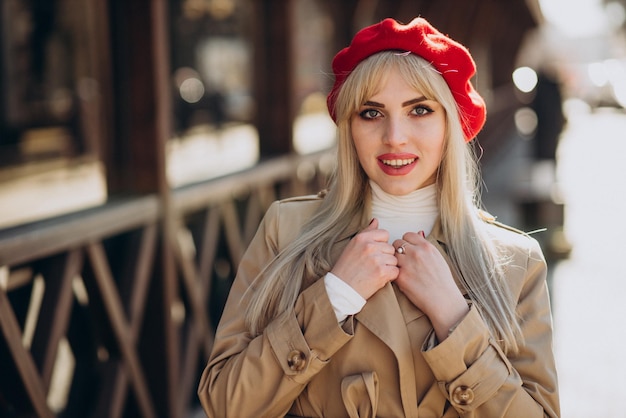 Young woman happy in red french beret