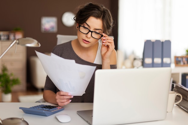 Young woman hard working at home