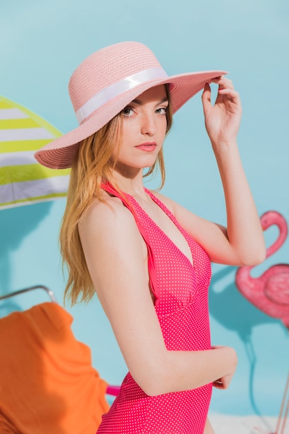 Young woman in hat on beach