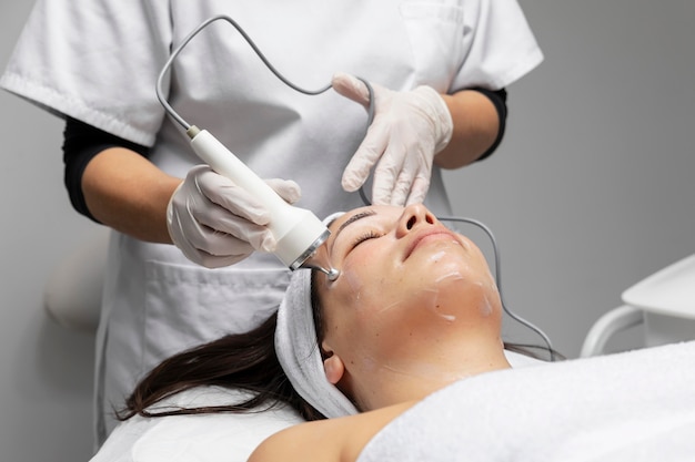 Young woman having a facial treatment