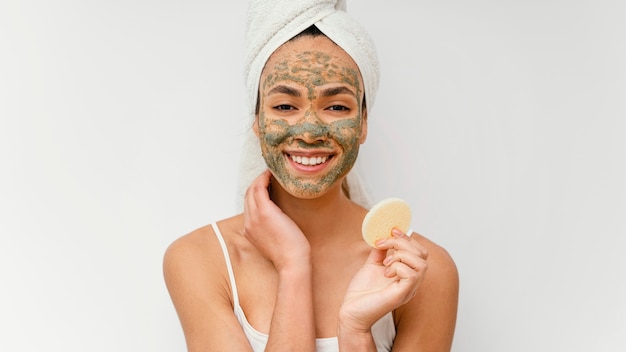 Young woman having a homemade mask on her face