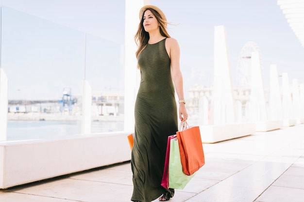 Young woman having a walk after shopping