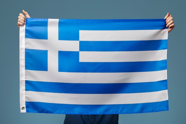 Young woman holding greece flag