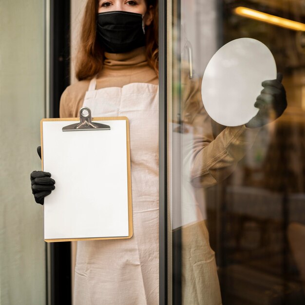 Young woman holding menu