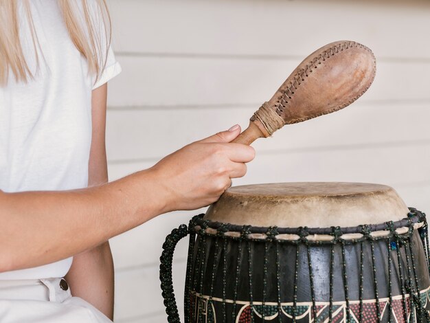 Young woman holding percussion instruments