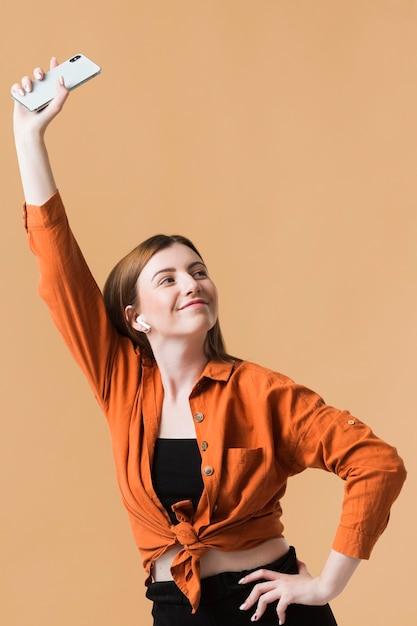 Young woman holding phone