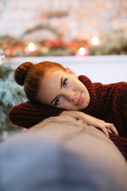 Young woman at home with Christmas decoration