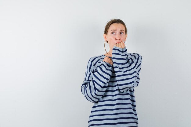 The young woman is feeling fear  on white background