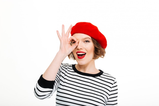 Young woman isolated showing okay gesture.