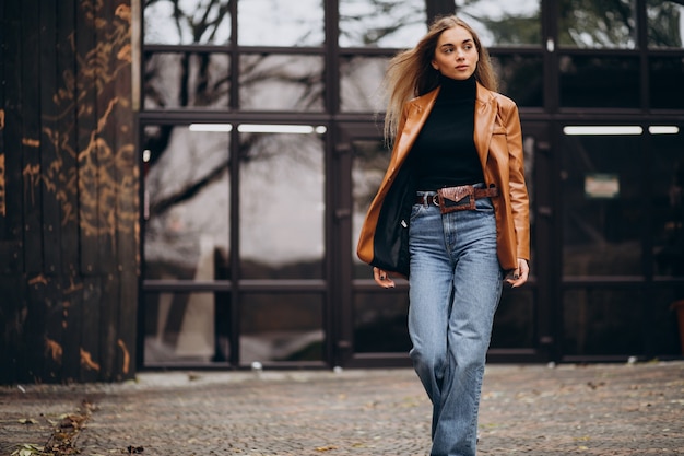 Free Photo young woman in jacket outside the street