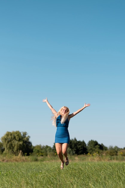 Young woman juming in the nature