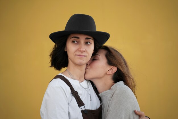 Young woman kissing her girlfriend