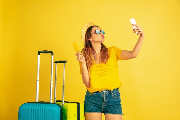 Young woman making selfie before traveling