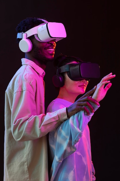 Young woman and man with vr glasses