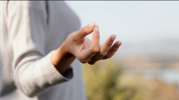 Young woman meditating in nature