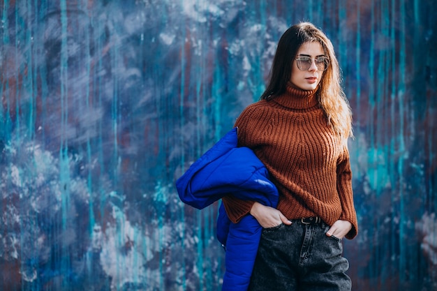 Young woman model in blue winter jacket