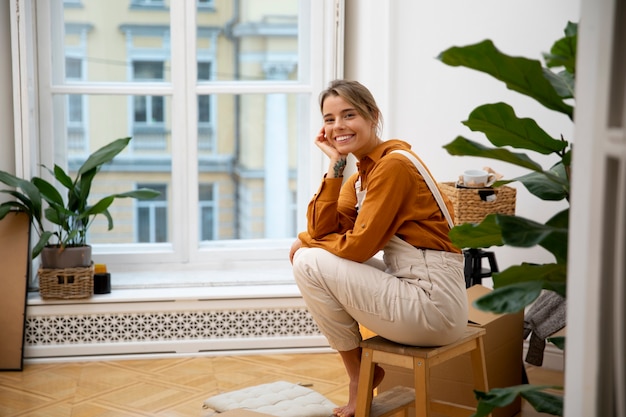 Young woman moving in new home