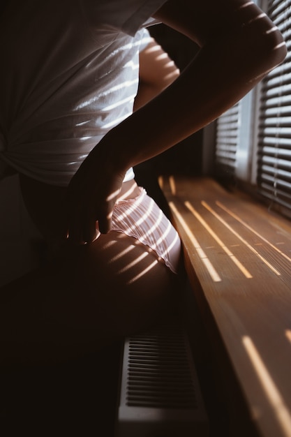 Young woman near the window in the morning