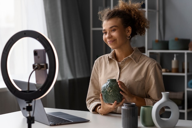 Free photo young woman organizing live shop