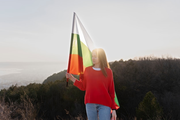 Free Photo young woman outdoors holding the bulgarian flag