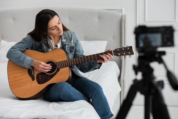 Young woman playing guitar