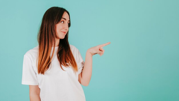 Young woman pointing right