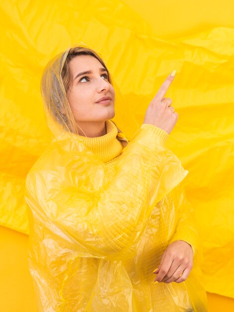 Young woman pointing up