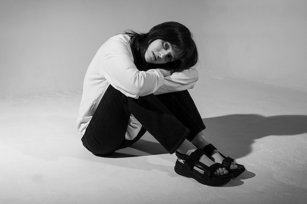 Young woman posing black and white full shot