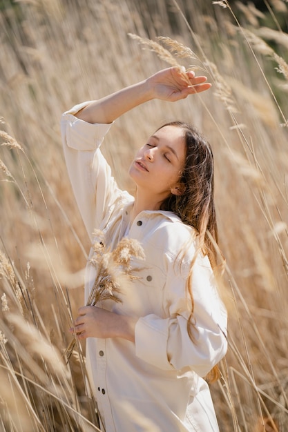 Young woman posing in a field