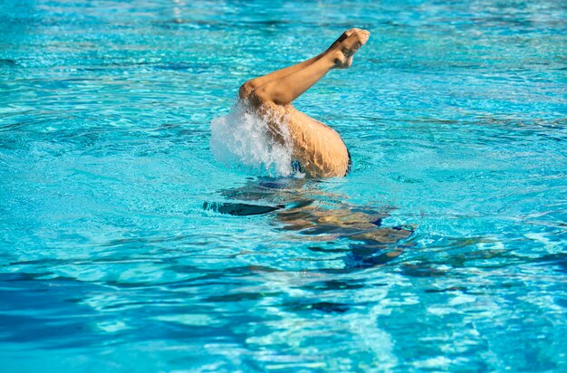 Young woman posing inside the swimming pool